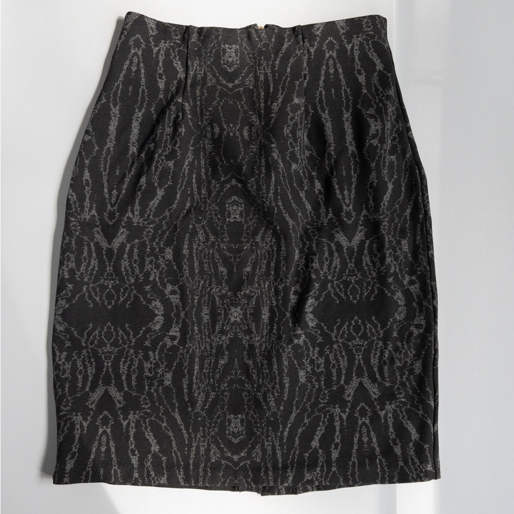 Black pattern pencil skirt with exposed metal zipper in the back.